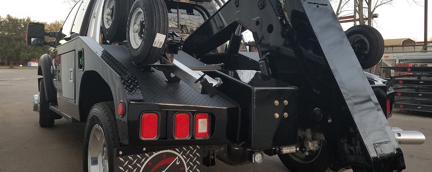 Black Ford power stroke tow truck